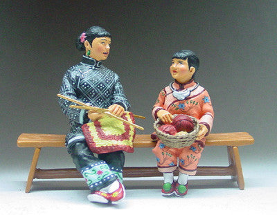 Sitting Mother and Daughter