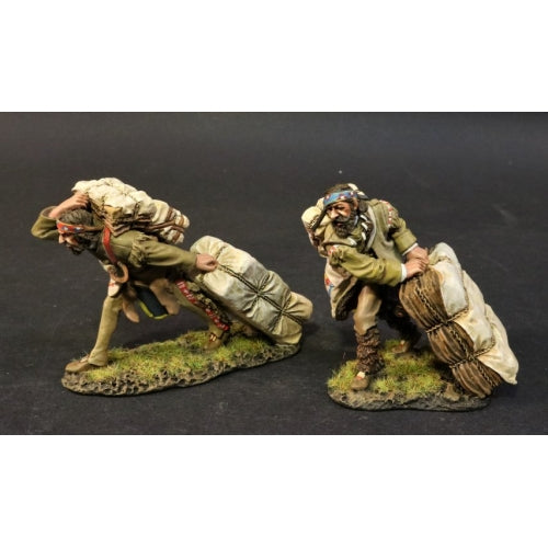 Two Mountain Men Moving Fur Bales