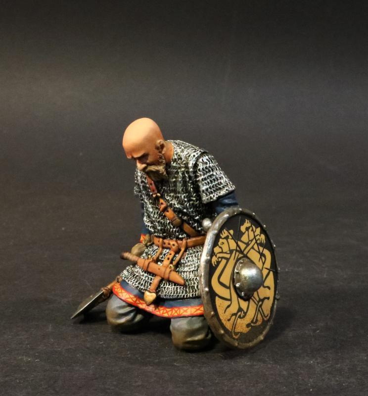 Kneeling Viking Warrior with axe and bald head (black shield with yellow monster pattern)